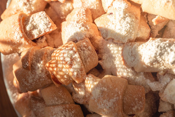 sweet homemade bagels, small in size, with jam sprinkled with icing sugar
