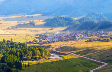 Rural landscape, Altai mountains. Evening light in a picturesque valley. 