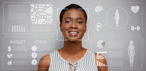Facial scan of African American girl on grey background with analytics on virtual computer screen, panorama