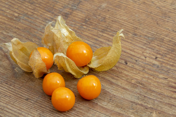 cape gooseberry fruits on a wooden board closeup