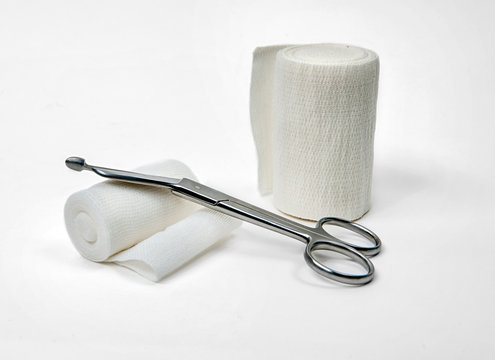 A set of bandage and scissors.