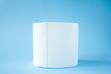 Toilet paper roll on a blue background top view. Toilet paper purchase due to kronavirus concept. Personal hygiene and stopping the spread of the virus. Cleanliness, Hygiene, Sterility