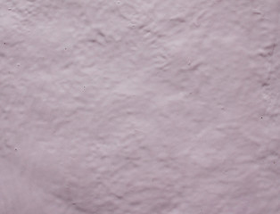 pink background the texture of the cracked paint resembles a shell