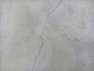 Crack of new concrete floor texture background. Broken concrete. Cracked concrete.