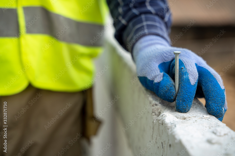 Poster engineer worker,construction build,professional repairman in helmet.man builder use hammer tool at c