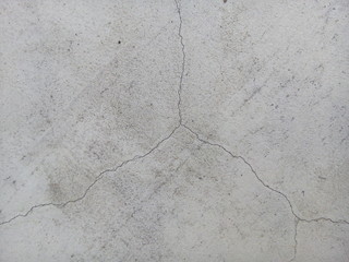 Crack of new concrete floor texture background. Broken concrete. Cracked concrete.