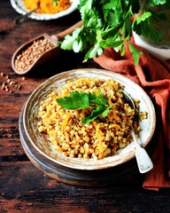 Buckwheat stew with vegetables in a ceramic bowl. rustic