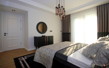 Modern and Stylish Bedroom Design with Furniture and Decorative Accessories at the New Home