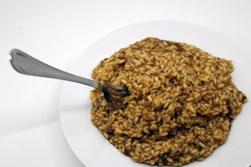 Risotto with mushrooms in white background