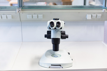 Laboratory microscope isolated on white close up