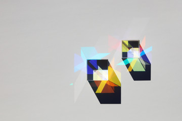 Two glass x-cubes create parallel shadows