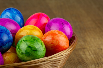 colorful easter eggs in an easter basket closeup