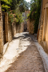 Fototapeta na wymiar Narrow street in Gordes village in France, Provence