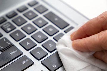 Keyboard disinfection during quarantine. Prevent covid-19 distribution, sanitize your laptop