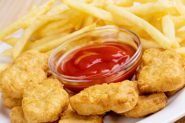 Delicious Chicken nuggets and french fries with ketchup