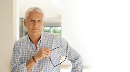 template, portrait of a senior man in a house