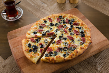 pide with olives and sausages cheese