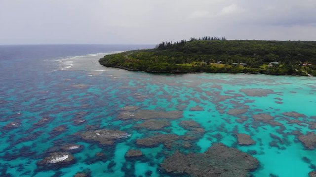 Aerial drone footage of Wadra Bay in Lifou New Caledonia.