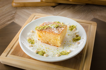 Eastern sweets in a wide range, baklava, Turkish delight with almond, cashew and pistachio nuts on plates