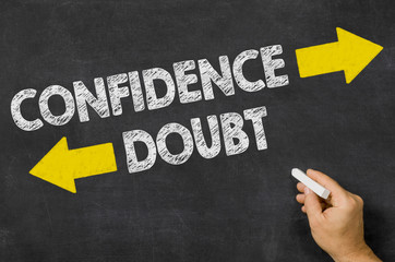 Confidence or Doubt written on a blackboard