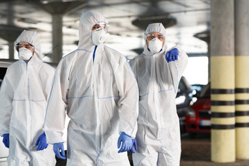 Men in hazmat suits pointing at you, epidemic, quarantine
