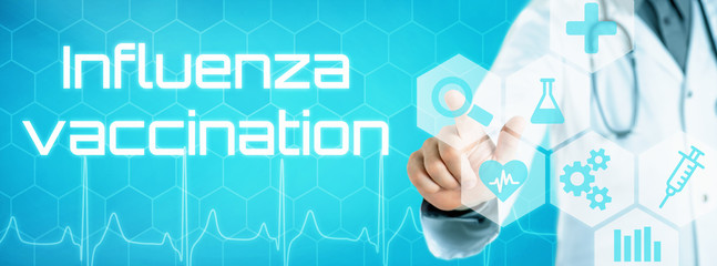 Doctor touching an icon on a futuristic interface - Influenza vaccination