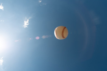 baseball ball in blue sky
