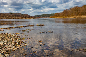 View of the Oka River in Russia in the spring in cloudy weather, beautiful river landscape.