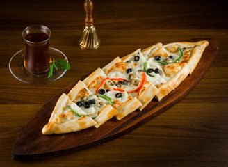 Turkish vegetarian pide with vegetables on wooden table pide with vegetable turkish cuisine