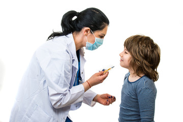 Doctor giving treatment injection to a boy