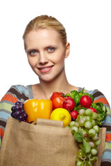 Woman holding grocery paper shopping bag full of fresh vegetables. Diet healthy eating concept isolated on a white background