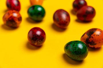 Colored easter eggs composite on a yellow background 