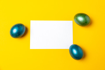 Colored easter eggs composite on a yellow background 