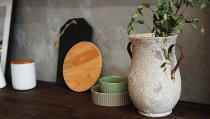 A vase with dry flowers on a table. Scandinavian classic kitchen, minimalistic interior design. Real photo. Cosy home.