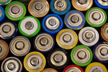 Many multicolored used batteries