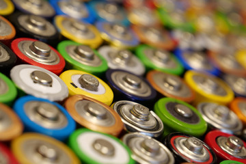 Many multicolored used batteries