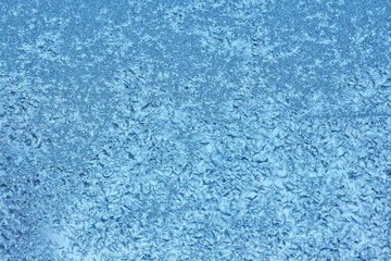 Fototapeta na wymiar Blue hoarfrost crystals background texture on glass