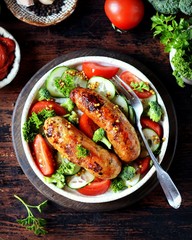 Homemade chicken (turkey) fried sausages with broccoli, tomato and cucumber salad 