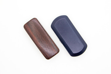 Two closed eye glasses cases isolated on white background. Top view studio shot.