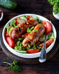 Homemade chicken (turkey) fried sausages with broccoli, tomato and cucumber salad 