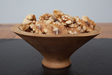 Walnuts in a small wooden bowl
