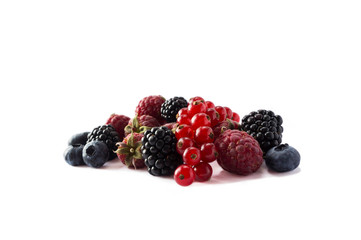 Ripe raspberries, red currants, blueberries and blackberries isolated on white background. Ripe and tasty berry with copy space for text. Mixed berries. Black and red berry on white background.