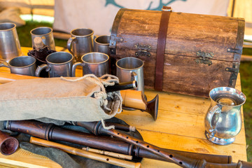 Table full of cups and old musical instruments