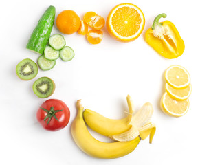 Various vegetables and fruits on a white background, top view, laid out in a circle. The concept of healthy eating, food background. Vegetable frame with space for text. Vegan, vegetarian.