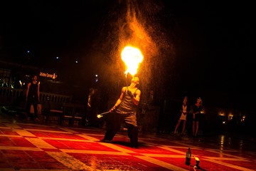 Fire show. Fire dancer dances with.