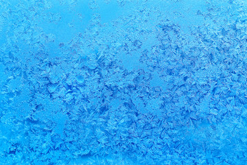 Fototapeta na wymiar Ice pattern on winter glass