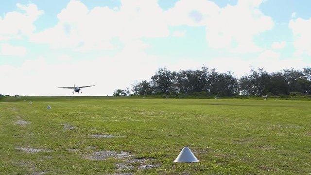 Small propeller plane landing - Lady Elliot Island (Slow Motion)