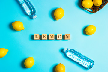 lemons and water on a yellow background. health concept. Slimming and diet