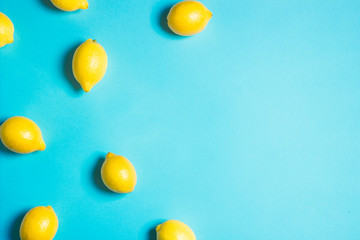 Lemons on a blue background with copy space. Health concept.