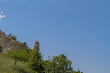 ruin of an old building with a higher tower